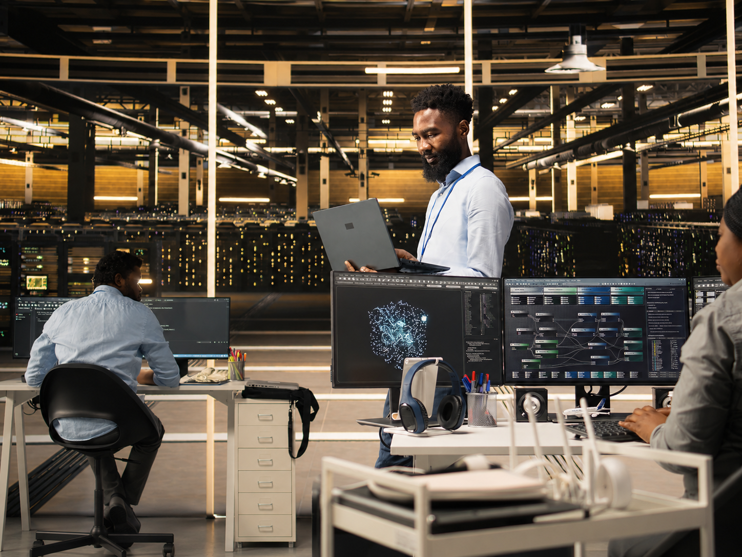 IT specialists monitoring enterprise servers and network infrastructure in a data centre